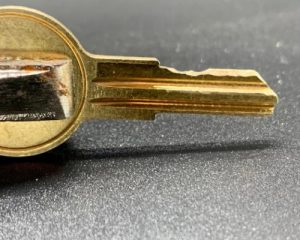 Identify the pin marks made on the key blank and file them down